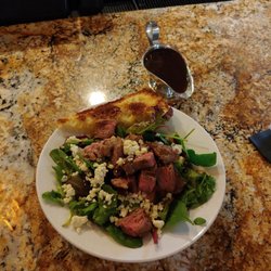 Gusher Bar & Patio - Steak salad, without onions or tomatoes.