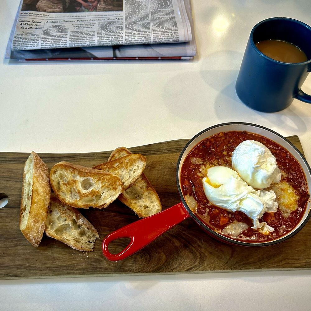 Artisan Eatery - The Pastrami Diablo with two perfectly poached eggs in a spicy tomato sauce, served alongside a toasted baguette - New American Near Me - Fort Myers, Florida