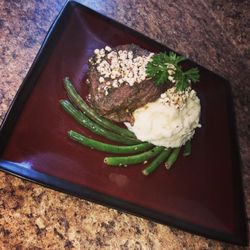 Flavorz Fuzion - Well Seasoned Filet Mignon Topped With Goat Cheese On A Bed Of Mashed Potatoes And Served With A Side Of Green Beans...