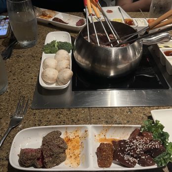 The Melting Pot - Several skeweres in trying to get everything to cook quickly so we could eat and head out - Fondue Near Me - Portland, Oregon