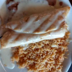 Nacho's - Chimichanga with beans and rice. Top with queso