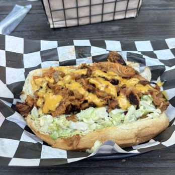 Lucy's on Lighthouse - Peaks: bacon wrapped hotdog with pulled or, kimchi, cole slaw, pimento cheese and Lucy sauce. - Hot Dogs Near Me - Pacific Grove, California