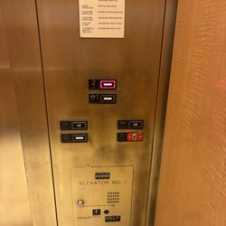 Dillard's - Tall Gold Kone Series 220 elevator, Dillard's The Shoppes at East Chase