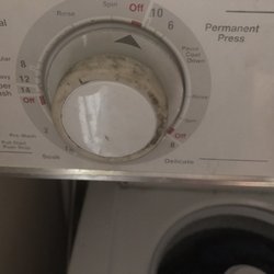 Hall Appliance - Grease covering washing machine knobs; also left by careless technicians.