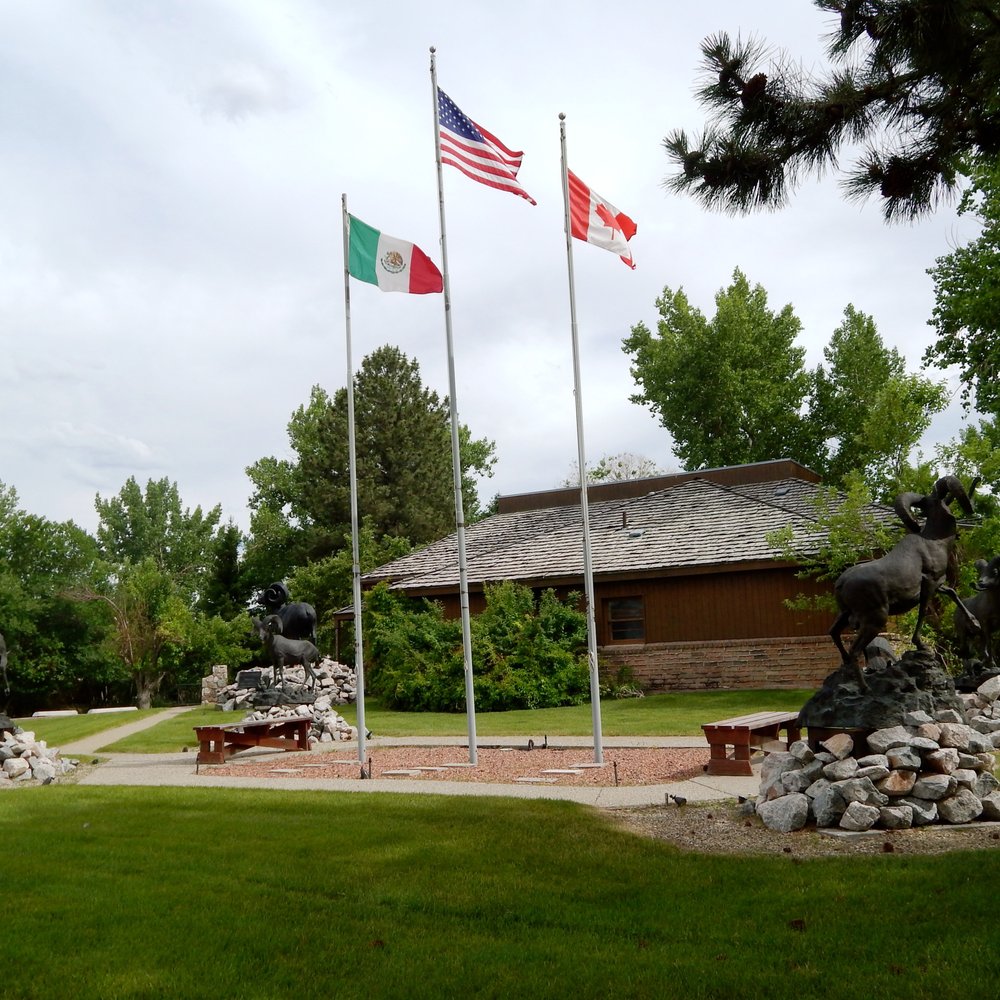 Foundation For North American Wild Sheep - Sheep statues, benches, and flags on the grounds. - Community Service/Non-Profit Near Me - Cody, Wyoming Foundation For North American Wild Sheep - Sheep statues, benches, and flags on the grounds. - Community Service/Non-Profit Near Me - Cody, Wyoming