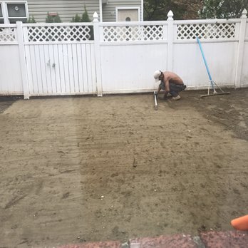 Gold Coast Pavers - Smoothing out the concrete sand - Masonry/Concrete Near Me - Old Bethpage, New York