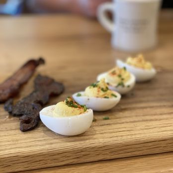 Magnolia Table - Bacon and deviled eggs appetizer (partly eaten) - Breakfast & Brunch Near Me - Waco, Texas Magnolia Table - Bacon and deviled eggs appetizer (partly eaten) - Breakfast & Brunch Near Me - Waco, Texas