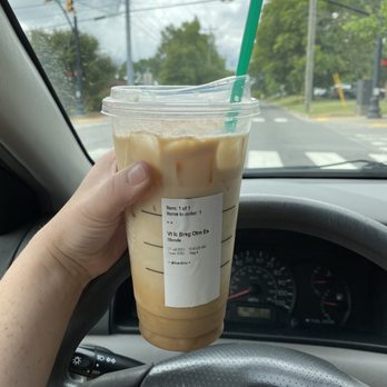 Starbucks - venti Brown sugar oat milk shaken espresso (stirred with my straw, not yet drunk) - Coffee & Tea Near Me - Nashville, Tennessee