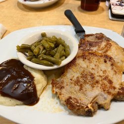 Perkins American Food - Grilled Garlic pork chops, green beans, and real mashed potatoes and brown gravy.