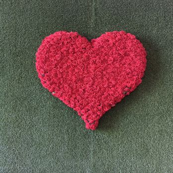 Cielo Party Decor & Rental - Red heart made of flowers on a green grass backdrop - Party & Event Planning Near Me Cielo Party Decor & Rental - Red heart made of flowers on a green grass backdrop - Party & Event Planning Near Me