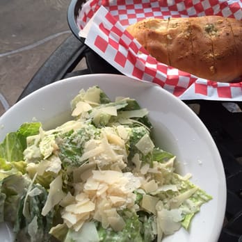 Micelis Waterfront Restaurant - Caesar salad and they're house garlic bread. - Italian Near Me - Matlacha, Florida Micelis Waterfront Restaurant - Caesar salad and they're house garlic bread. - Italian Near Me - Matlacha, Florida