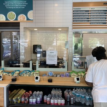 Chopt Creative Salad Co. - a woman standing at a counter - Salad Near Me - Atlanta, Georgia Chopt Creative Salad Co. - a woman standing at a counter - Salad Near Me - Atlanta, Georgia