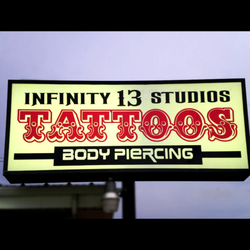 Infinity 13 Studios Denton - Sign at the front of the shop