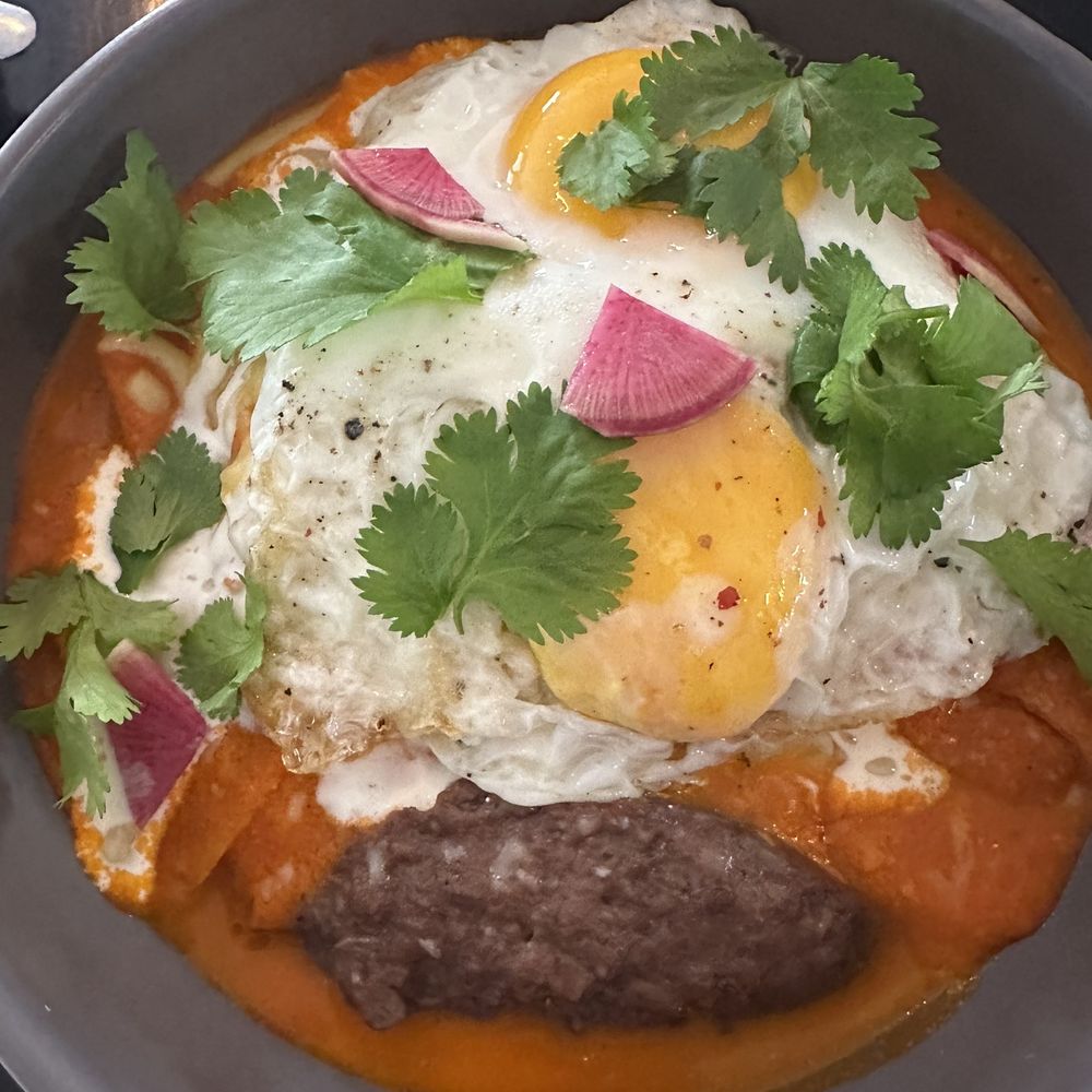Chilaquiles with fried eggs. Chilaquiles with fried eggs.