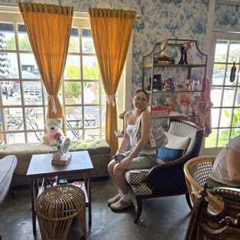 Blooming Floral Cafe - My daughter posing at our seat - Coffee & Tea Near Me - Tampa, Florida