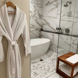 Tributary Hotel - Thisbathtub was extremely comfortable and they had beautiful bath salts that were replenished with their evening Turn Down service.