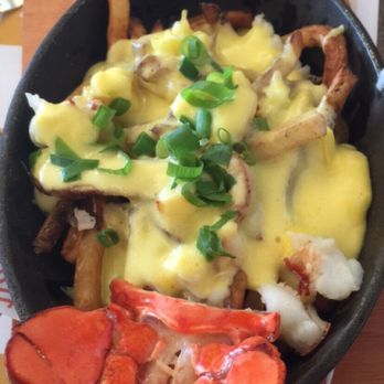 Flour Mill Scratch Kitchen Restaurant - Lobster poutine. Small quantity of lobster. Lots of overcooked fries. - Canadian (New) Near Me - Niagara Falls, Ontario