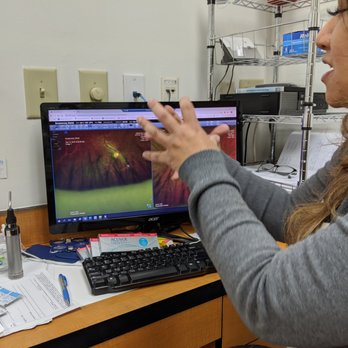 Atlanta Eye Center - Dr. Raharja explaining the retinal images her staff took of the backs of my eyeballs. - Optometrists Near Me - Atlanta, Georgia Atlanta Eye Center - Dr. Raharja explaining the retinal images her staff took of the backs of my eyeballs. - Optometrists Near Me - Atlanta, Georgia