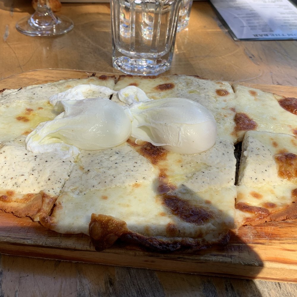 WILD - Truffle pizza with poached eggs - New American Near Me - New York, New York WILD - Truffle pizza with poached eggs - New American Near Me - New York, New York