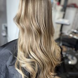 Beauty Town Salon - Blond highlights in her natural base color..