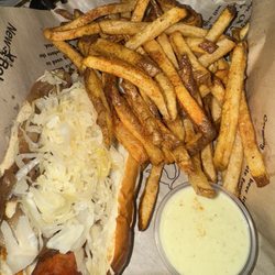 New Bohemia - New Orleans cajun andouille Brat (added kraut and carmalized onions) with fries and side of melted pepper jack cheese