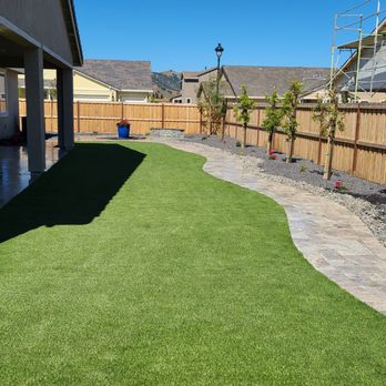 Crown Landscape Contractors - a backyard with artificial grass - Landscaping Near Me Crown Landscape Contractors - a backyard with artificial grass - Landscaping Near Me