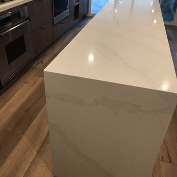 Giallo Stone - Kitchen island with waterfall edge. - Kitchen & Bath Near Me - Los Angeles, California Giallo Stone - Kitchen island with waterfall edge. - Kitchen & Bath Near Me - Los Angeles, California