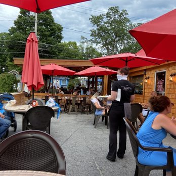 The Huddle Kitchen & Bar - Outdoor patio - New American Near Me - Bolton Landing, New York The Huddle Kitchen & Bar - Outdoor patio - New American Near Me - Bolton Landing, New York
