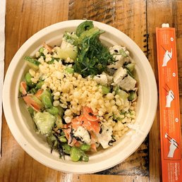Regular tofu bowl, white rice, all mix ins, avocado lime dressing, tempura, ginger, and a tiny taste of seaweed salad. Regular tofu bowl, white rice, all mix ins, avocado lime dressing, tempura, ginger, and a tiny taste of seaweed salad.