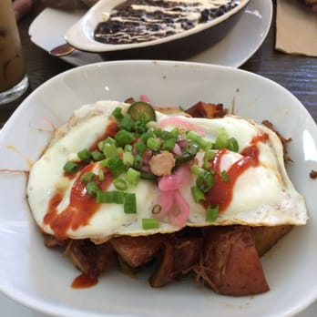 Claudia's - Fried eggs w/ carnitas & homefries (Baked-eggs in the background) - Bars Near Me - Brooklyn, New York