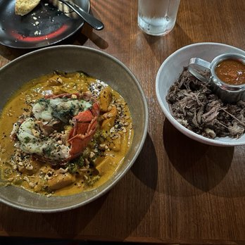 Okan - Cashew Curry with a side of jerk goat. - African Near Me - Bluffton, South Carolina