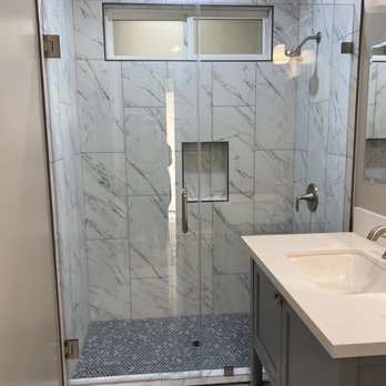 Vixco Glass Depot - Frameless shower door in small bathroom - Glass & Mirrors Near Me