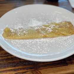 Berries & Batter Cafe - Crepe with powdered sugar.