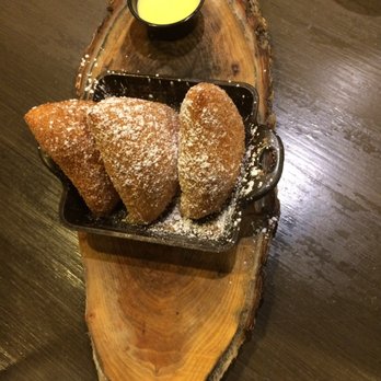The Row - Nashville beignets: so fluffy! They're sprinkled w cinnamon & sugar and come with a side of créme anglaise - Southern Near Me - Nashville, Tennessee The Row - Nashville beignets: so fluffy! They're sprinkled w cinnamon & sugar and come with a side of créme anglaise - Southern Near Me - Nashville, Tennessee