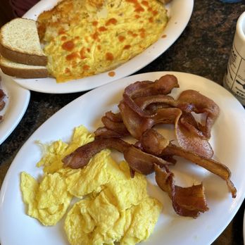 Cheryl's Place - The eggs and bacon with her pancake!! Also, my friends omelet (with hot sauce) - Breakfast & Brunch Near Me - Brighton, Michigan