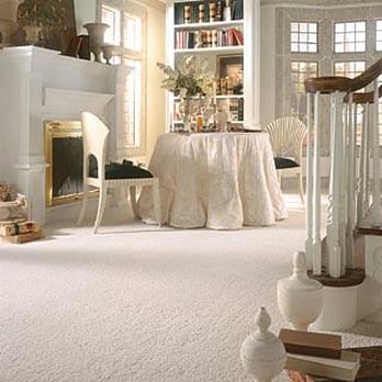 Coast Floor & Tile Group - a living room with white carpet and a fireplace - Flooring Near Me - Tarpon Springs, Florida Coast Floor & Tile Group - a living room with white carpet and a fireplace - Flooring Near Me - Tarpon Springs, Florida