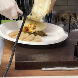Orrman's Cheese Shop - Raclette being scraped into my plate, sensuous enough to be sinful.