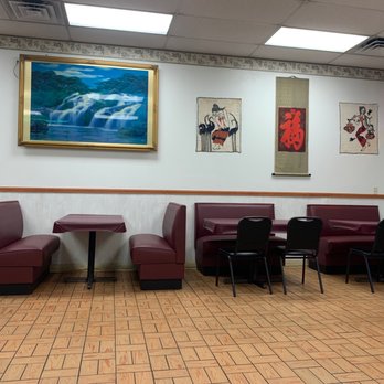 Mandarin Kitchen - a dining area with red chairs and tables - Chinese Near Me - Elkhart, Indiana