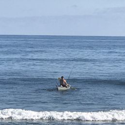 a surfer in the ocean a surfer in the ocean