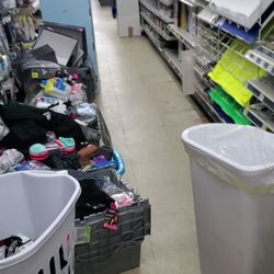 Dollar General - Looks like a hoarders house. All the aisles are lined with stuff needing to be put away. Employees are just standing around
