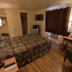 Falls Motel - We found hard wood floors in a couple rooms, so we refinished them. We think they look great!