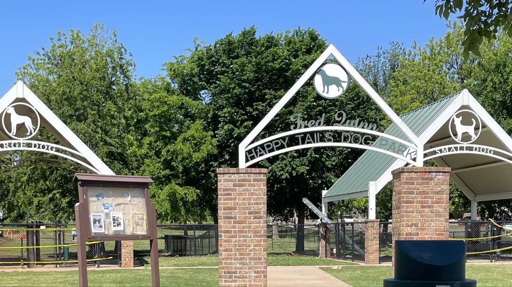 Fred Quinn Happy Tails Dog Park Logo