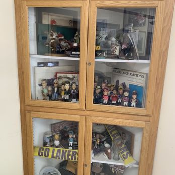 Gene's Grinders - Cabinet of vintage figurines tucked in the corner - Delis Near Me - Duarte, California