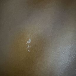 Outside material rubbed off somehow on a $8k couch before 3 months, and even after paying $1k for "Elite" coverage this is not covered.scam Outside material rubbed off somehow on a $8k couch before 3 months, and even after paying $1k for "Elite" coverage this is not covered.scam