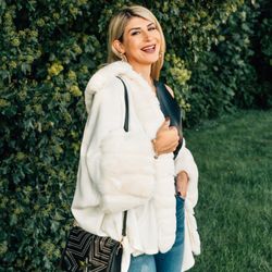 Boutique 44 - Woman wearing a faux fur wrap.