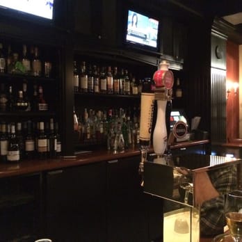 Canto - a television and liquor bottles - Bars Near Me - Toronto, Ontario