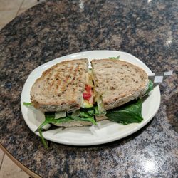 Caffe Motivo - Grilled Popeye sandwich. Spinach, zucchini, onion, sun-dried tomato, 2 types of cheese, pesto mayo. Awesome