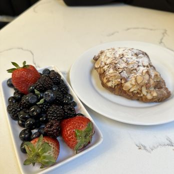 Bisou - a plate of fruit and a pastry on a table - Coffee & Tea Near Me - Kansas City, Missouri