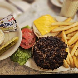 Jahns Since 1897 - CHEESEBURGER Topped with Melted American Cheese & Served on a Toasted Bun with Cole Slaw & Pickle