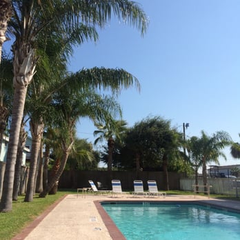 Tarpon Inn - Tarpon Inn Poolside relaxing under the Port A palm trees - Hotels Near Me - Port Aransas, Texas Tarpon Inn - Tarpon Inn Poolside relaxing under the Port A palm trees - Hotels Near Me - Port Aransas, Texas